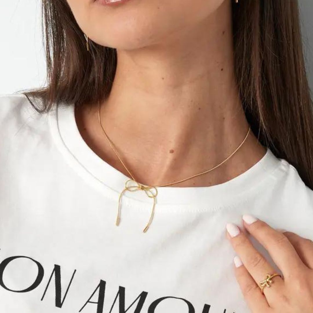 Collier fantaisie noeud papillon chaîne maille serpent en acier inoxydable doré Chiara